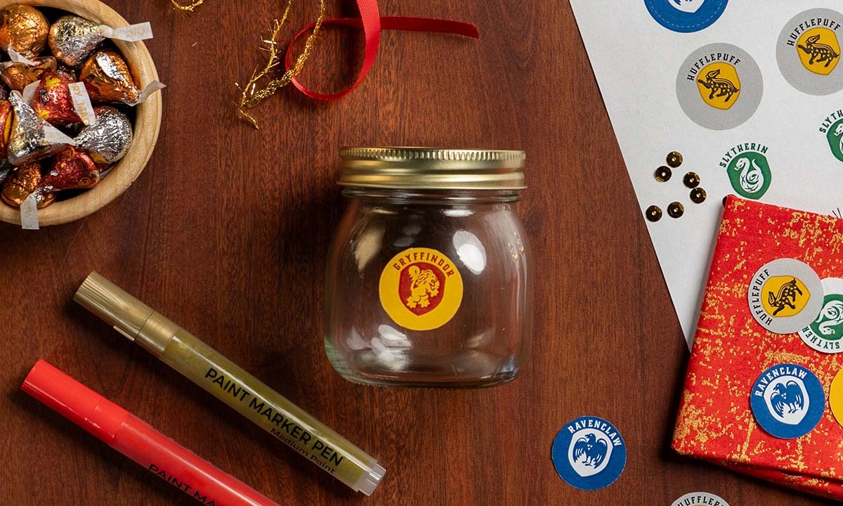 glue the hogwarts house emblems onto the mason jars