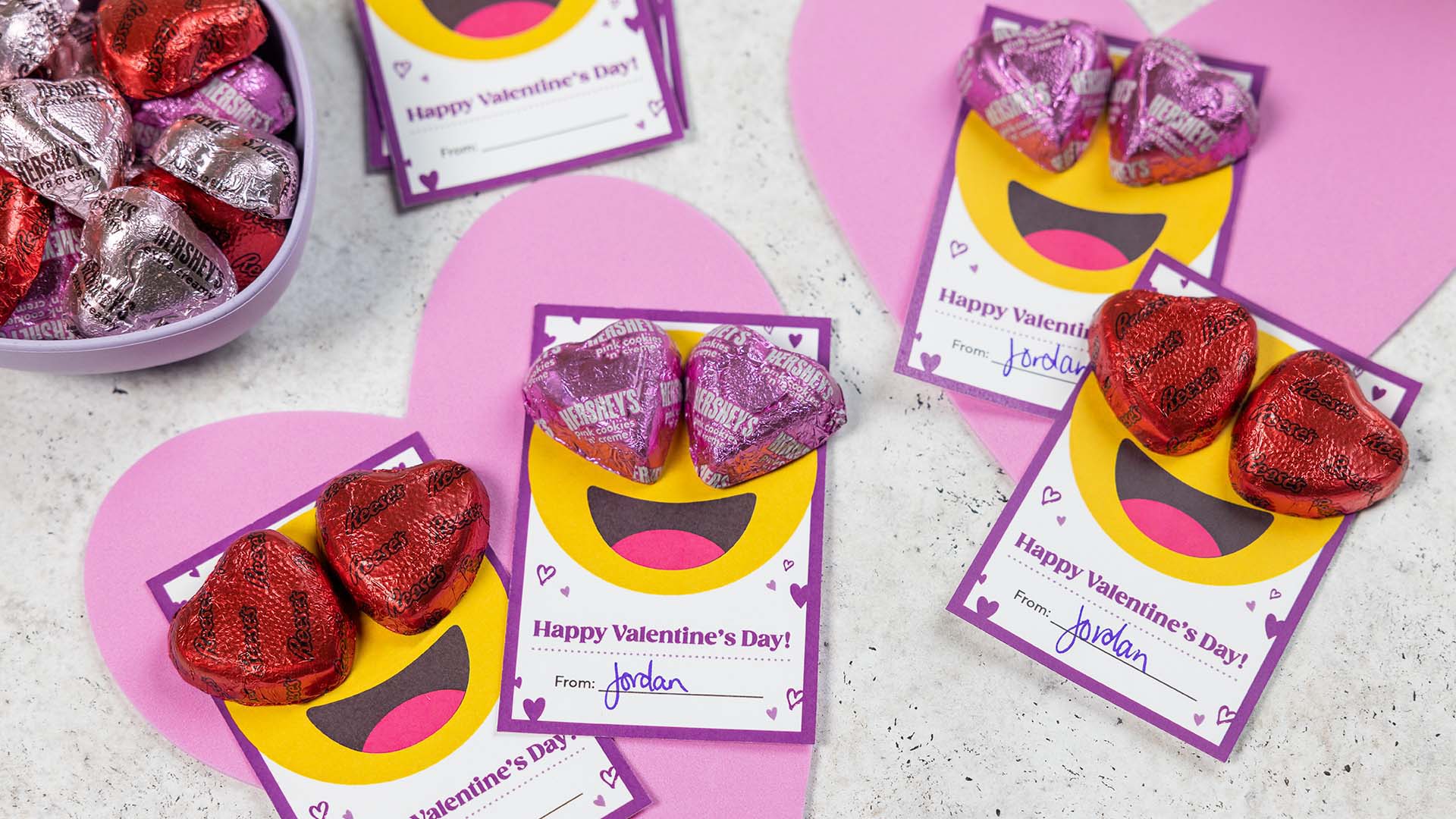 emoji candy heart valentines exchange cards filled out and topped with candy